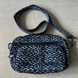 Lightly used Lug Carousel crossbody bag. Adjustable strap expands up to 26”.